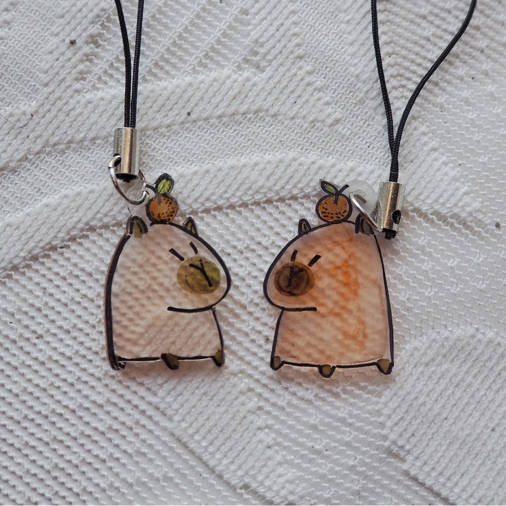One handcrafted capybara heat-shrink pendant